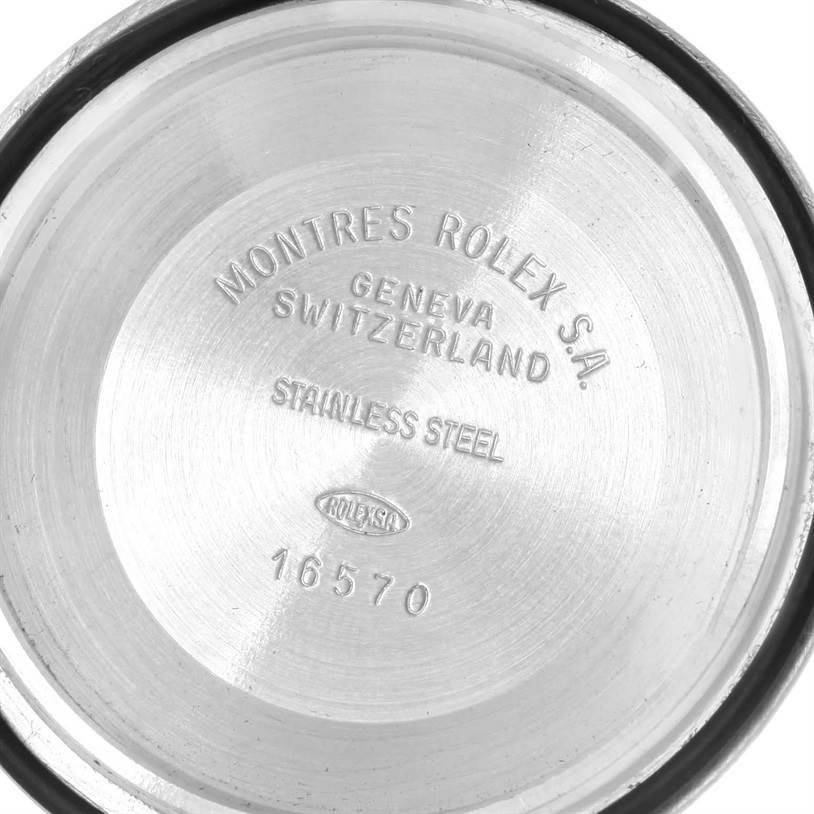 This image shows the inside of the back case of a Rolex Explorer 16570 Men's Stainless Steel White Dial 16570 Men's Stainless Steel White Dial model watch, displaying engravings and markings.