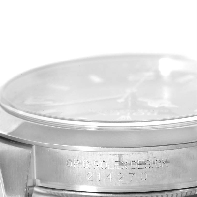 The image shows a close-up of the side and caseback of a Rolex Explorer 214270 Men's Stainless Steel Black Dial 214270 Men's Stainless Steel Black Dial watch from an angle that focuses on the model number engraving.