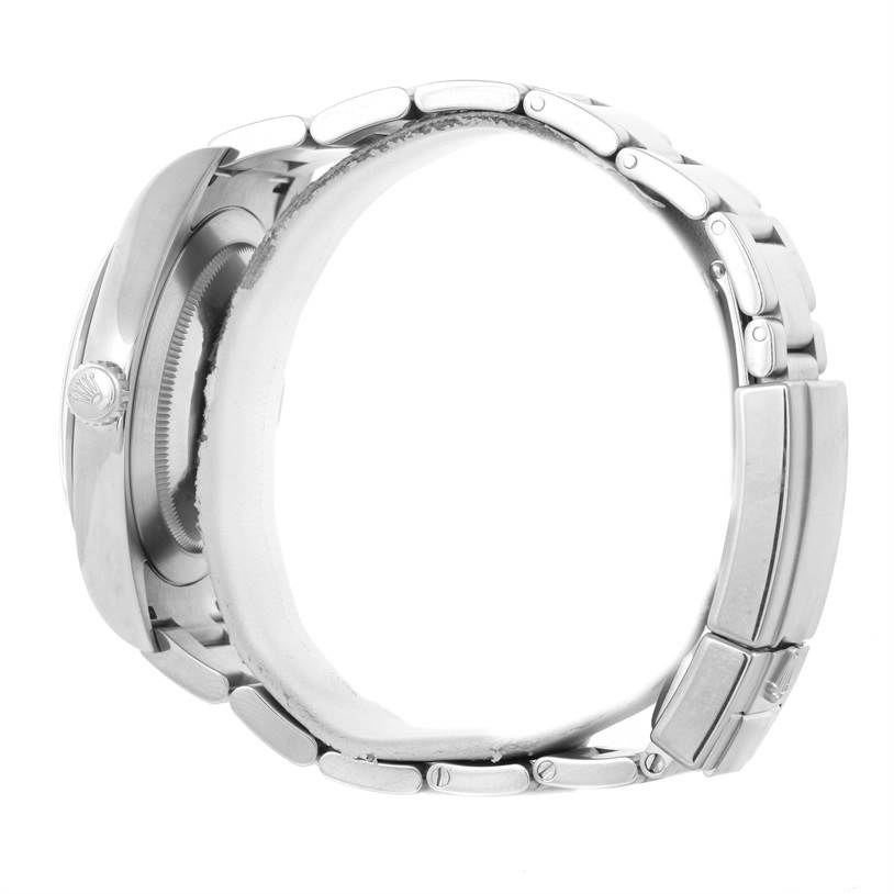 The image shows the side and clasp of a Rolex Explorer 214270 Men's Stainless Steel Black Dial 214270 Men's Stainless Steel Black Dial model watch, displaying its metallic bracelet and case.