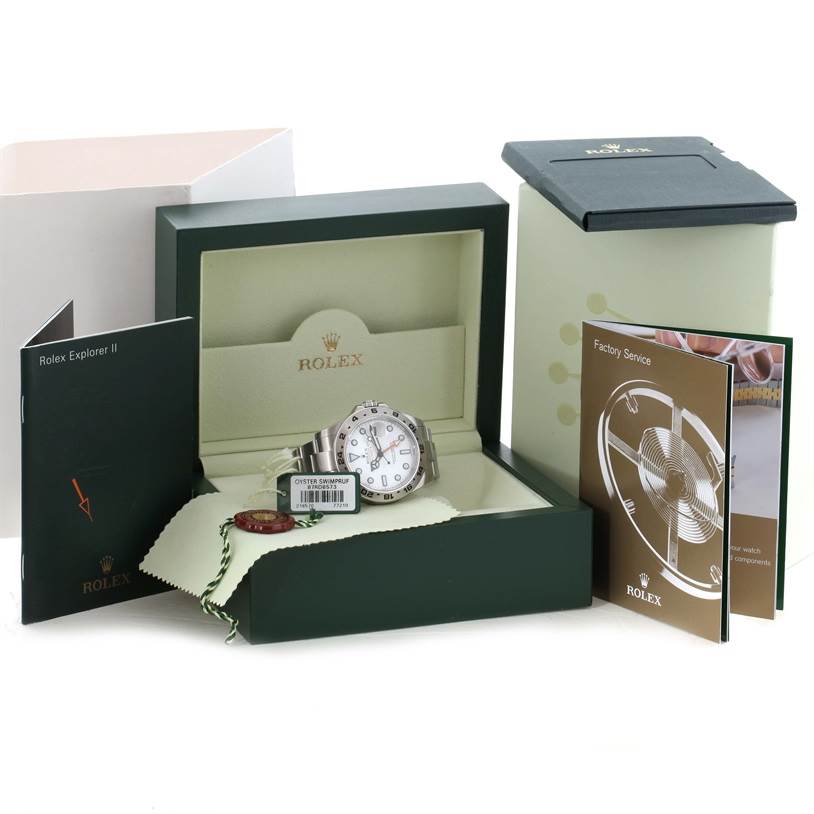 This image shows a Rolex Explorer 216570WSO Men's Stainless Steel White Dial 216570WSO Men's Stainless Steel White Dial watch in its open box, accompanied by booklets and a tag.