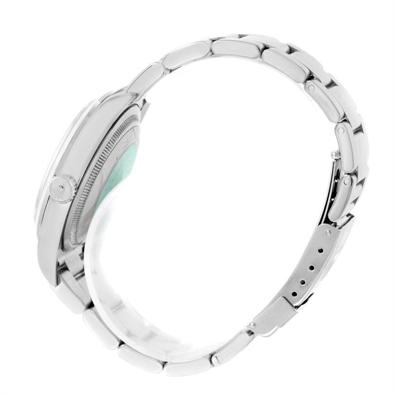 The image shows a side view of a Rolex Explorer 114270 Men's Stainless Steel Black Dial 114270 Men's Stainless Steel Black Dial model, focusing on its case, crown, and bracelet.