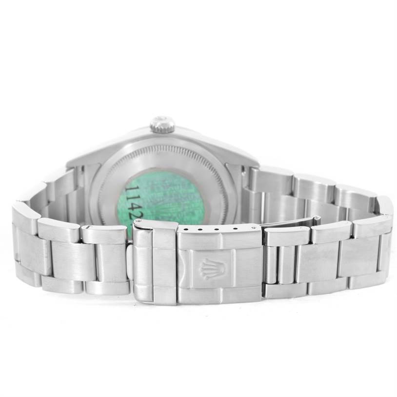 The image shows the back view of a Rolex Explorer 114270 Men's Stainless Steel Black Dial 114270 Men's Stainless Steel Black Dial's case, highlighting its bracelet and clasp.