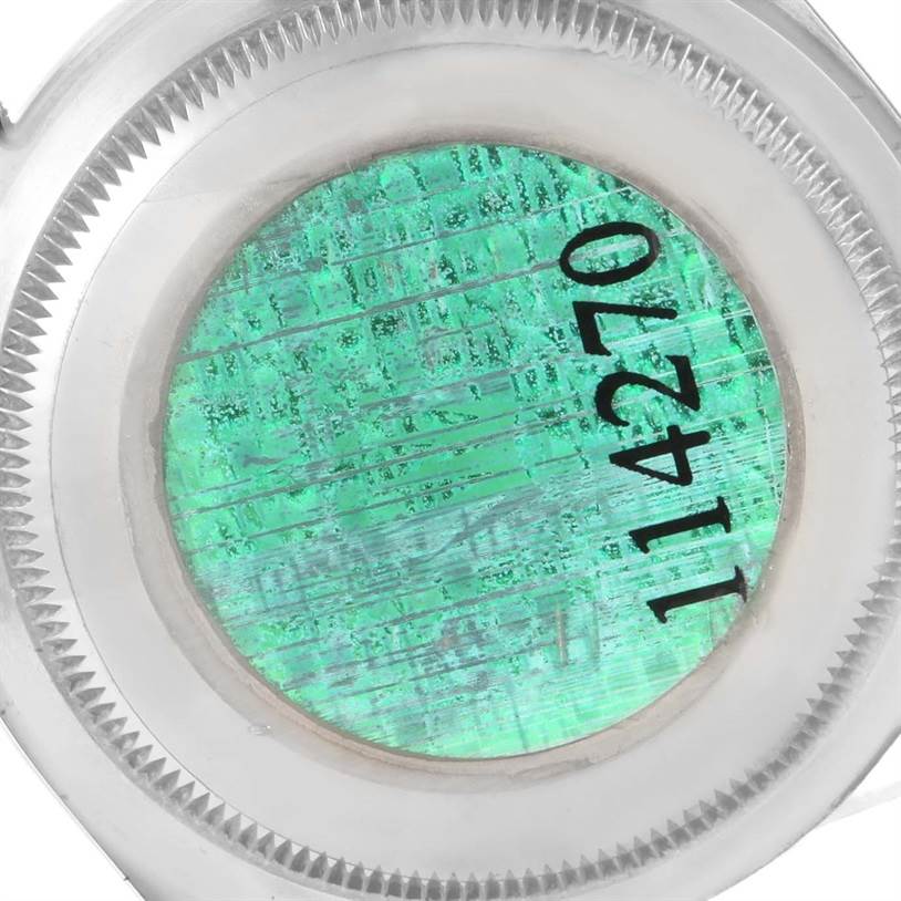 This image shows a close-up of the case back of a Rolex Explorer 114270 Men's Stainless Steel Black Dial 114270 Men's Stainless Steel Black Dial model watch, highlighting the hologram sticker with the reference number.