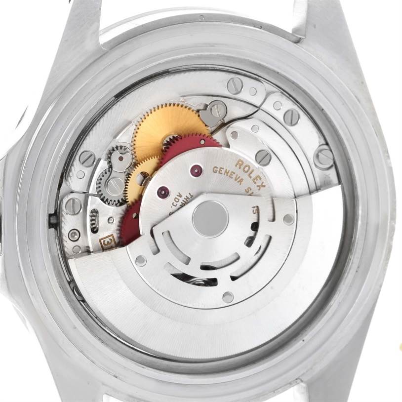 The image shows the back view of the Rolex Explorer 16570 Men's Stainless Steel White Dial 16570 Men's Stainless Steel White Dial model, focusing on its intricate movement and internal mechanical parts.