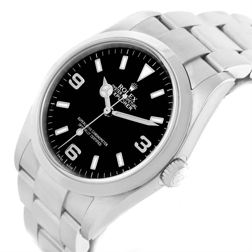 The Rolex Explorer 114270 Men's Stainless Steel Black Dial 114270 Men's Stainless Steel Black Dial watch is shown at a tilted angle, displaying the face, crown, and part of the bracelet.