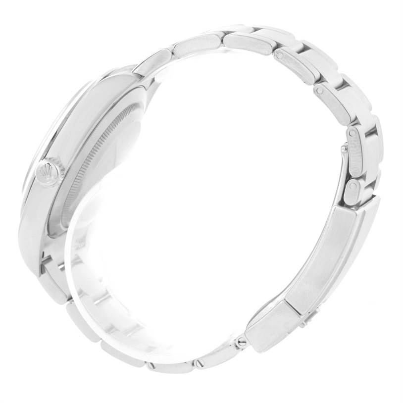 This side view of the Rolex Explorer 214270 Men's Stainless Steel Black Dial 214270 Men's Stainless Steel Black Dial watch showcases its case, bracelet, and crown.