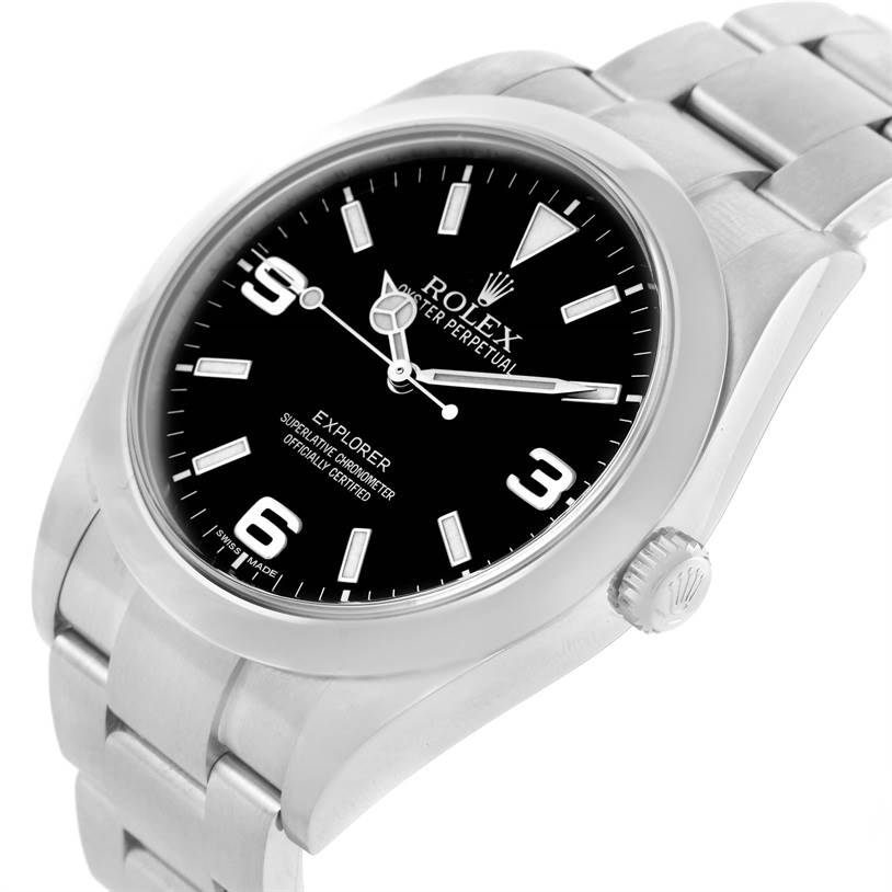 The Rolex Explorer 214270 Men's Stainless Steel Black Dial 214270 Men's Stainless Steel Black Dial watch is shown from an angled close-up, displaying the face, bezel, crown, and part of the bracelet.