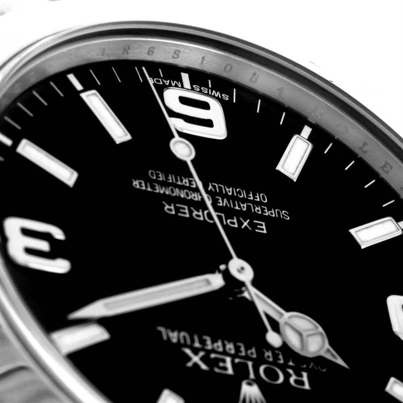 The image shows a close-up, angled view of the dial of a Rolex Explorer 214270 Men's Stainless Steel Black Dial 214270 Men's Stainless Steel Black Dial watch, highlighting the 3, 6, and 9-hour markers.