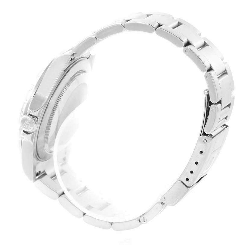 This side view of the Rolex Explorer 16570 Men's Stainless Steel White Dial 16570 Men's Stainless Steel White Dial watch showcases the case, crown, and bracelet.