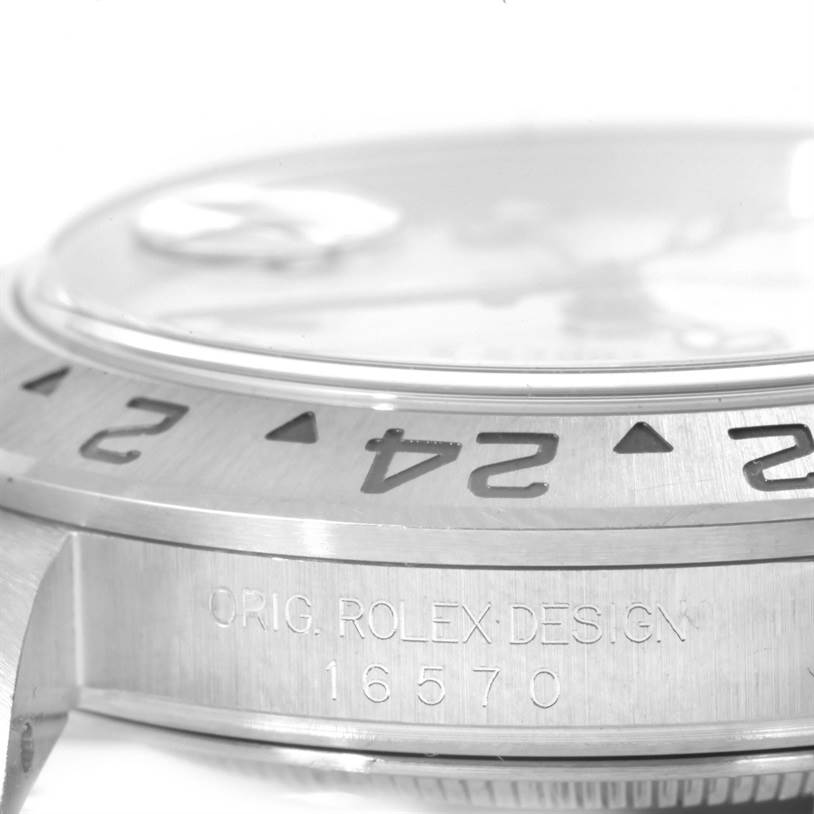 The image shows a close-up angled view of the side and bezel of a Rolex Explorer 16570 Men's Stainless Steel White Dial 16570 Men's Stainless Steel White Dial watch, revealing its model number 16570.