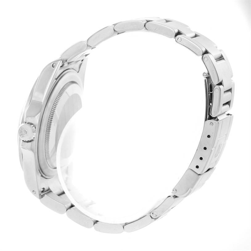 The image shows a side view of a Rolex Explorer 16570 Men's Stainless Steel White Dial 16570 Men's Stainless Steel White Dial watch, highlighting the crown, case, and stainless steel bracelet.