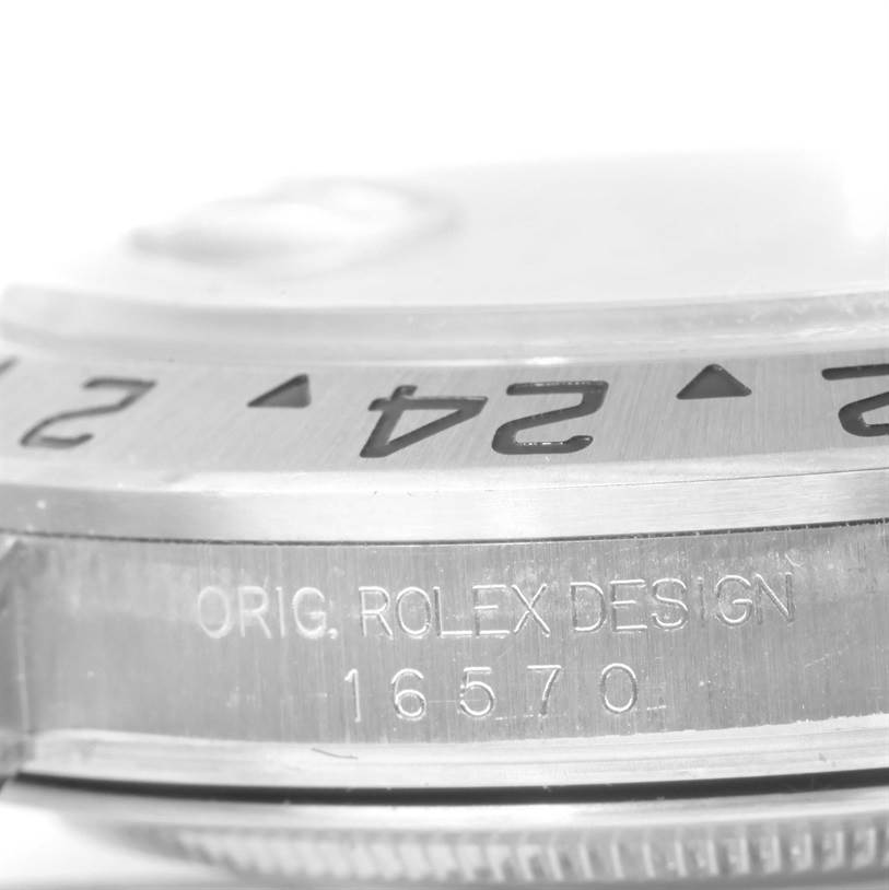 The image shows a close-up of the engraved side of a Rolex Explorer 16570 Men's Stainless Steel Black Dial 16570 Men's Stainless Steel Black Dial watch, highlighting the bezel and case.