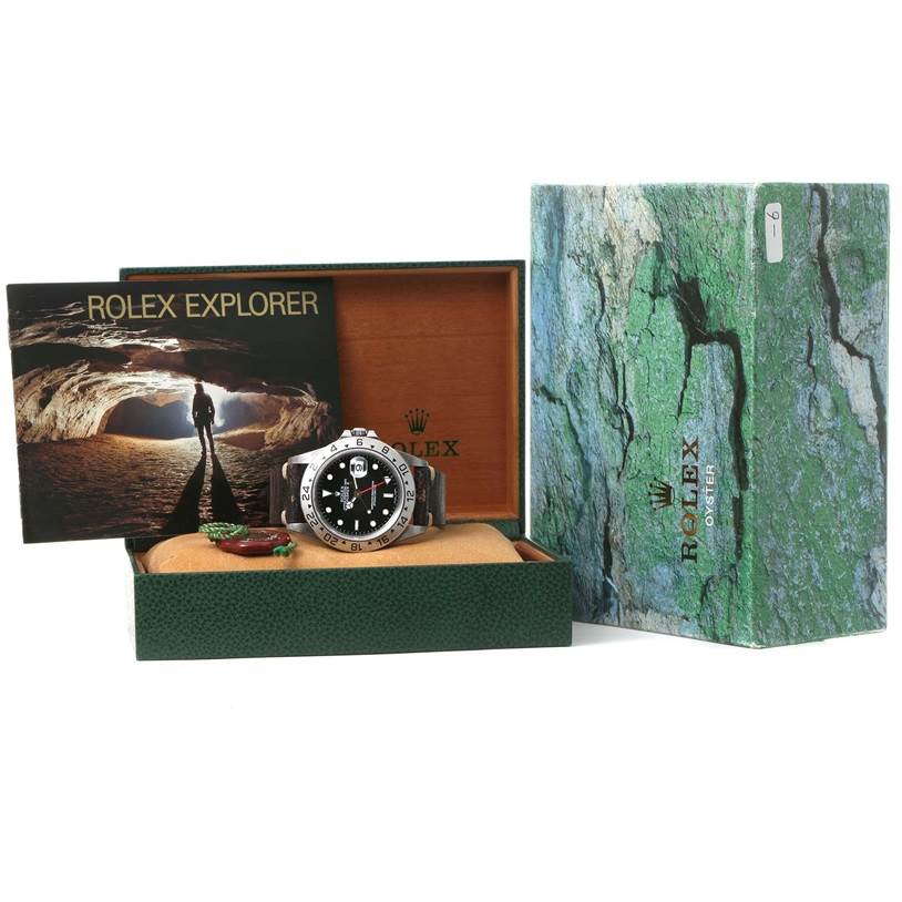 This image shows the Rolex Explorer 16570 Men's Stainless Steel Black Dial 16570 Men's Stainless Steel Black Dial watch, its box, and manual from a front angle.