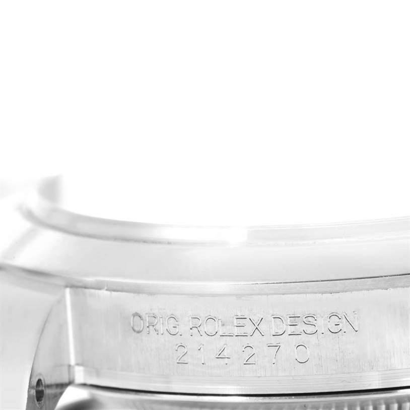 The image shows a close-up of the side of a Rolex Explorer 214270 Men's Stainless Steel Black Dial 214270 Men's Stainless Steel Black Dial watch, featuring the engraved model number and design notation.