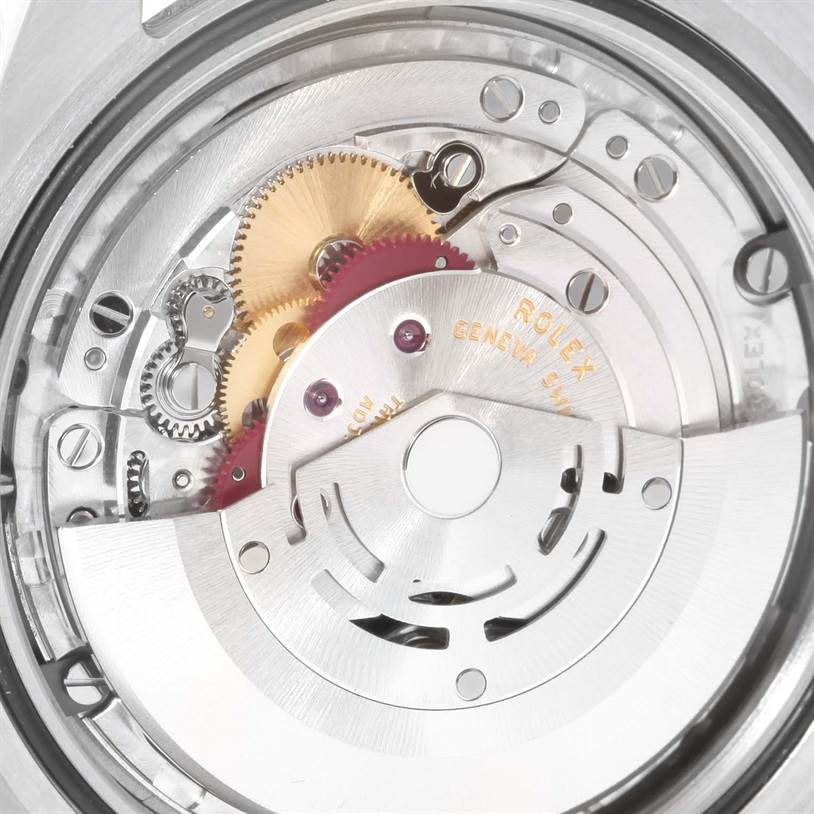 This image shows the intricate internal mechanics of a Rolex Explorer 214270 Men's Stainless Steel Black Dial 214270 Men's Stainless Steel Black Dial watch, highlighting gears and the rotor from a close-up angle.
