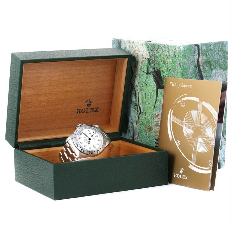 The image shows a Rolex Explorer 16570 Men
s Stainless Steel White Dial 16570 Men
s Stainless Steel White Dial watch in an open Rolex box, accompanied by a booklet and outer packaging.