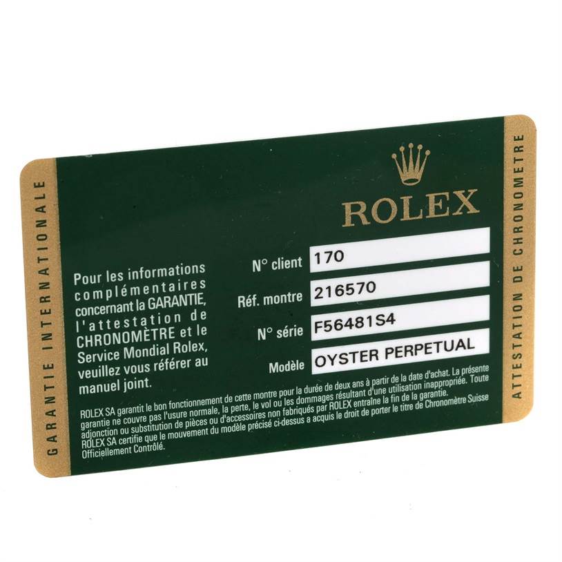 This image shows an international warranty card for a Rolex Explorer 216570 Men
s Stainless Steel Black Dial 216570 Men
s Stainless Steel Black Dial model with client number, reference number, and serial number details.
