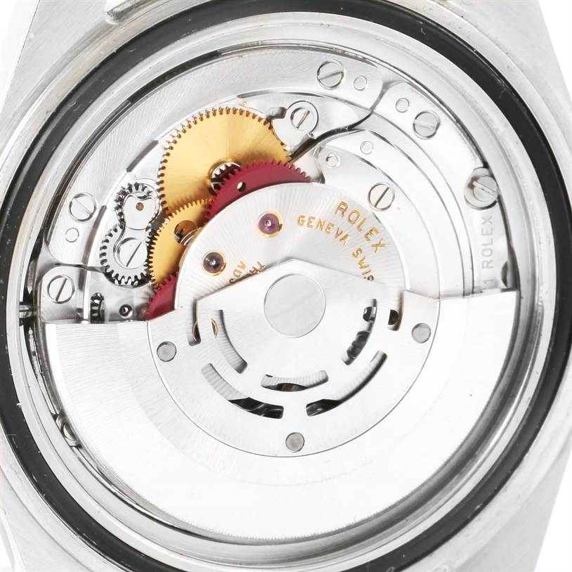 The image shows an internal view of the Rolex Explorer 16570 Men's Stainless Steel White Dial 16570 Men's Stainless Steel White Dial's automatic movement mechanism, including gears and the rotor.