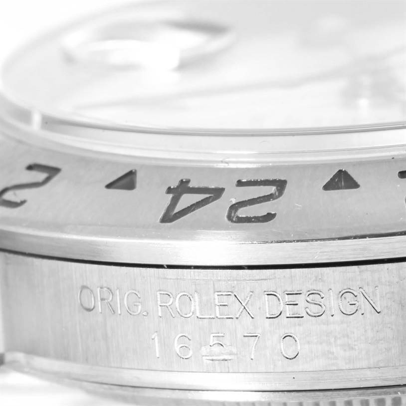 This image shows the side view of a Rolex Explorer 16570 Men's Stainless Steel White Dial 16570 Men's Stainless Steel White Dial watch, focusing on the bezel and engraved model number.
