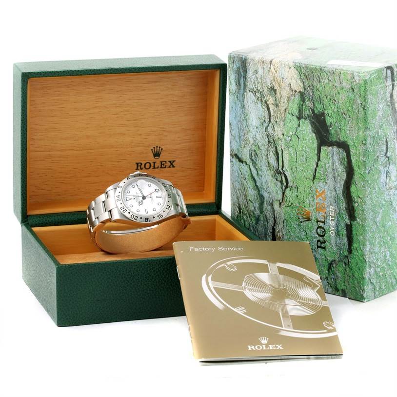 The image shows a Rolex Explorer 16570 Men's Stainless Steel White Dial 16570 Men's Stainless Steel White Dial watch in its case with a warranty booklet and outer box.