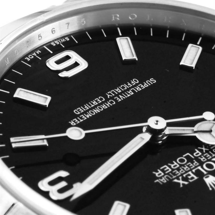 This image shows a close-up angle of the dial on a Rolex Explorer 114270 Men's Stainless Steel Black Dial 114270 Men's Stainless Steel Black Dial watch, highlighting the hands, markers, and part of the bezel.
