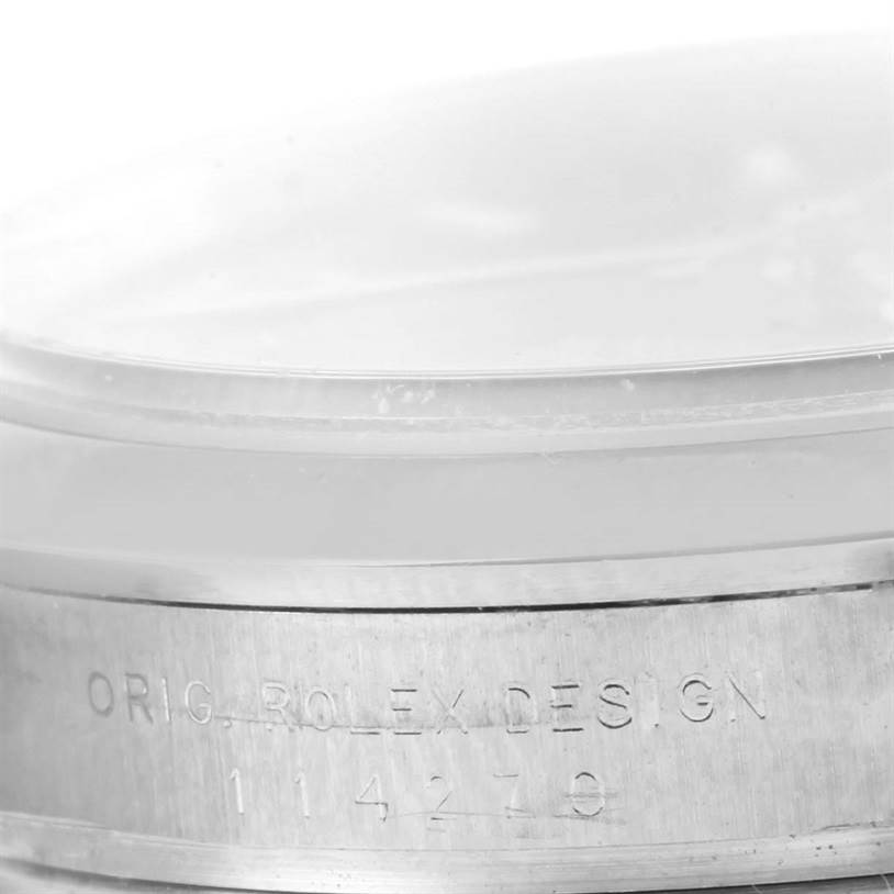 This close-up image shows the engraved side of the case with the model number of a Rolex Explorer 114270 Men's Stainless Steel Black Dial 114270 Men's Stainless Steel Black Dial watch.