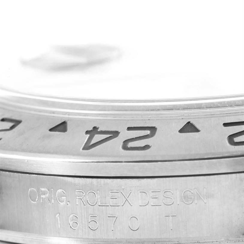 This image shows a close-up of the bezel and engraving on the Rolex Explorer 16570 Men's Stainless Steel White Dial 16570 Men's Stainless Steel White Dial model 16570.