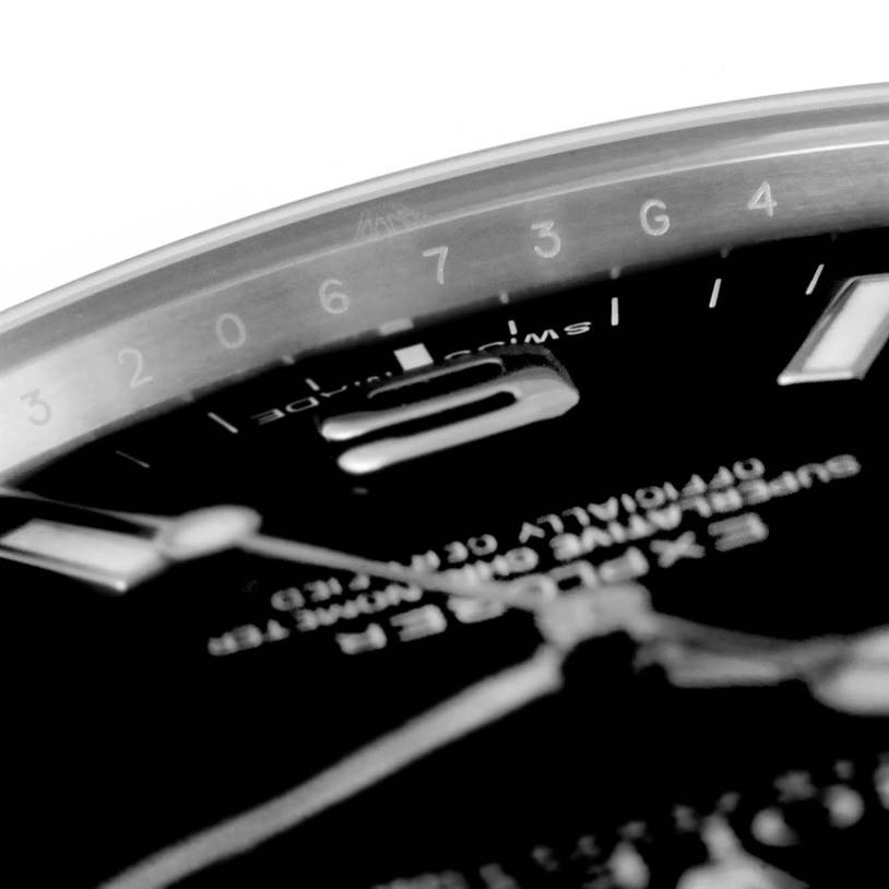 The image shows a close-up, angled view of the dial and bezel of the Rolex Explorer 214270 Men's Stainless Steel Black Dial 214270 Men's Stainless Steel Black Dial watch.