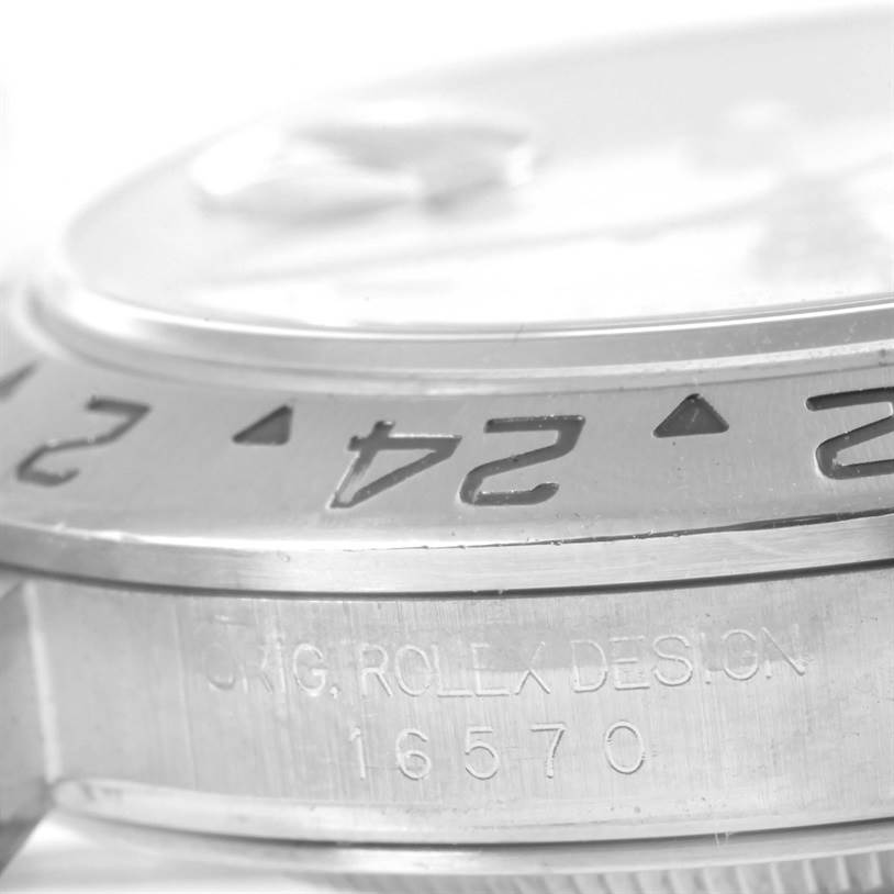 This close-up image shows the bezel and side of the case of a Rolex Explorer 16570 Men's Stainless Steel White Dial 16570 Men's Stainless Steel White Dial model.