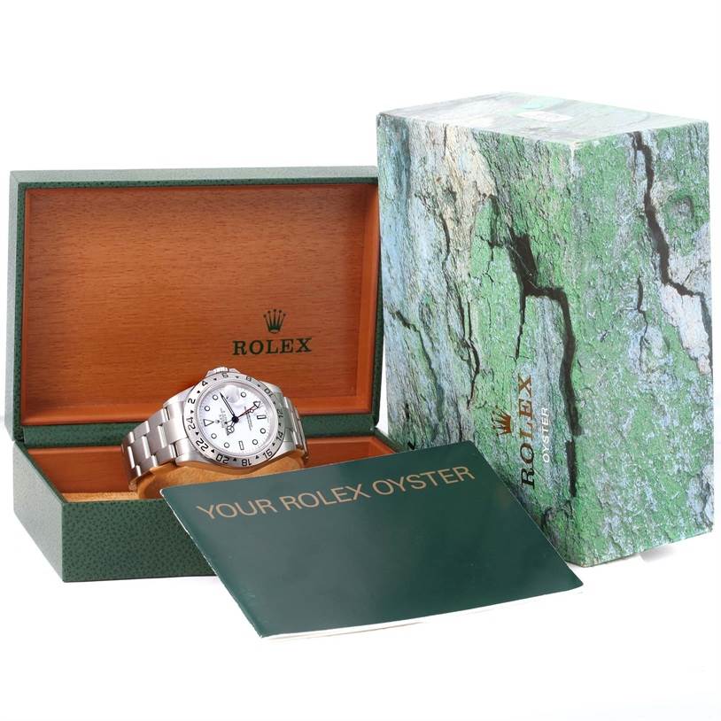 This image shows a Rolex Explorer 16570 Men's Stainless Steel White Dial 16570 Men's Stainless Steel White Dial watch displayed in an open box, alongside its outer box and booklet.