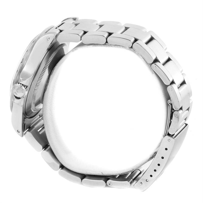 The image shows a side view of a Rolex Explorer 16570 Men's Stainless Steel White Dial 16570 Men's Stainless Steel White Dial watch, highlighting the crown, case, and stainless steel bracelet clasp.