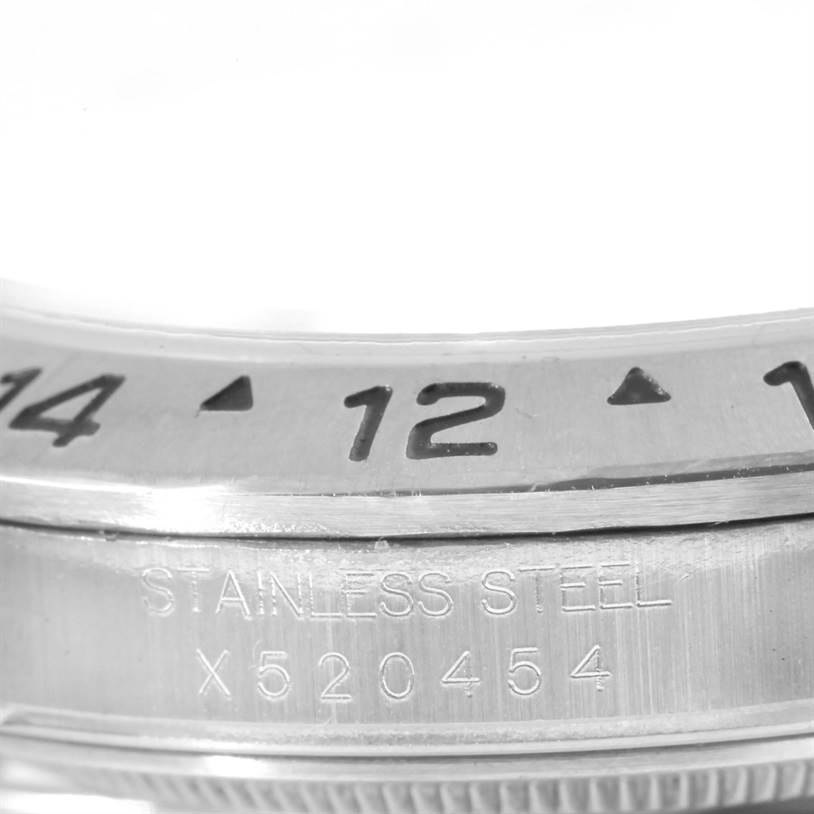 This image shows a close-up of the bezel and serial number of a Rolex Explorer 16570 Men's Stainless Steel White Dial 16570 Men's Stainless Steel White Dial model watch.