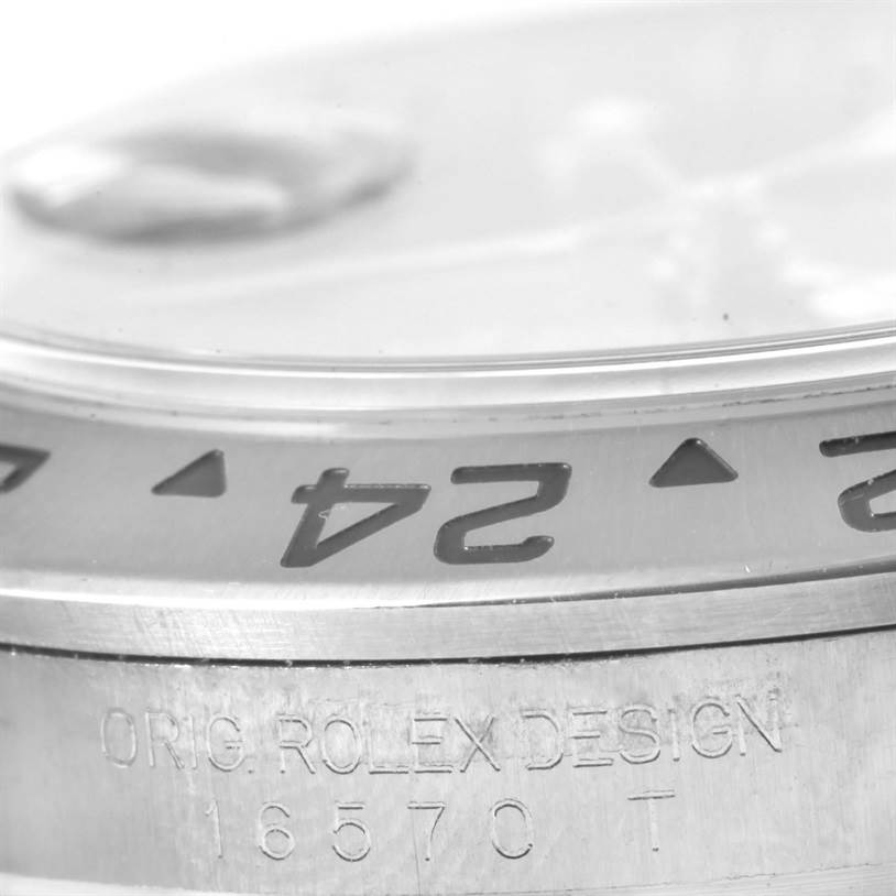 This image shows a close-up of the bezel and model engraving (16570) on a Rolex Explorer 16570 Men's Stainless Steel Black Dial 16570 Men's Stainless Steel Black Dial watch.