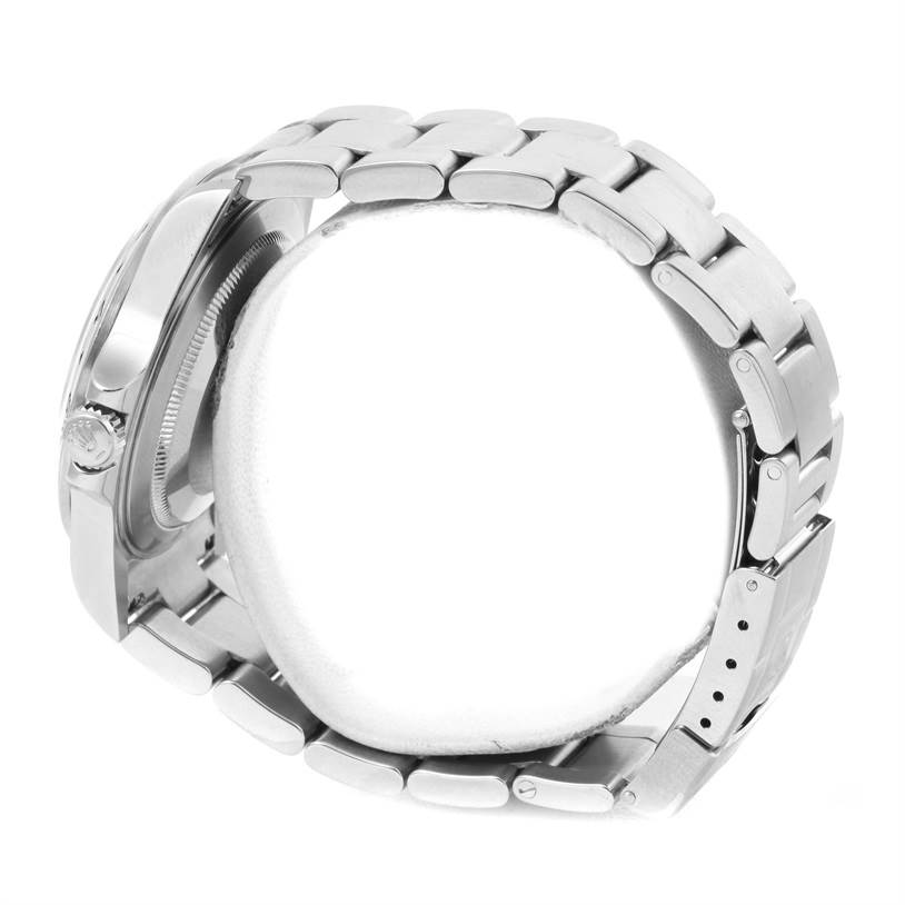 The image shows a side angle of a Rolex Explorer 16570 Men's Stainless Steel White Dial 16570 Men's Stainless Steel White Dial watch focusing on the bracelet and crown.