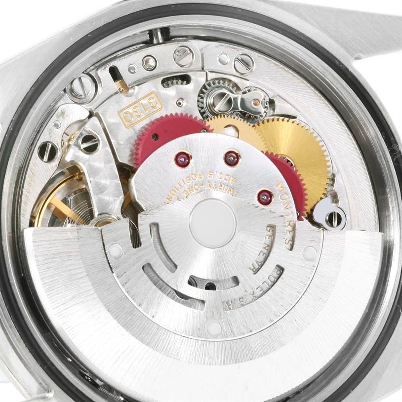 This is a close-up of the inner mechanism of a Rolex Explorer 114270 Men's Stainless Steel Black Dial 114270 Men's Stainless Steel Black Dial watch, showing the gears and rotor.