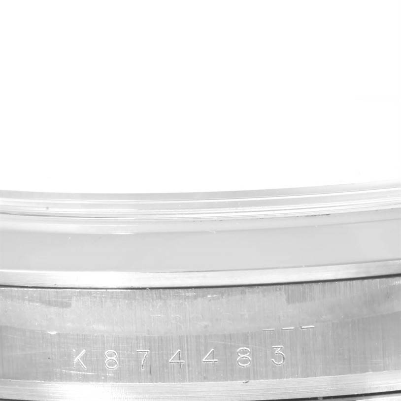 This image shows a close-up of the serial number engraved on the case of a Rolex Explorer 114270 Men's Stainless Steel Black Dial 114270 Men's Stainless Steel Black Dial watch.
