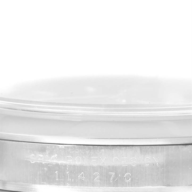 This image shows a close-up of the case back engraving of a Rolex Explorer 114270 Men's Stainless Steel Black Dial 114270 Men's Stainless Steel Black Dial model, focusing on the model number "114270."