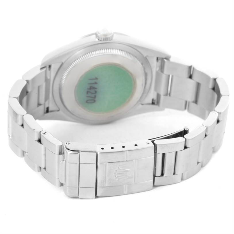 The image shows the rear view of a Rolex Explorer 114270 Men's Stainless Steel Black Dial 114270 Men's Stainless Steel Black Dial watch, highlighting the metal bracelet and the case back.