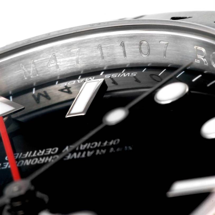 This close-up image of the Rolex Explorer 16570 Men's Stainless Steel Black Dial 16570 Men's Stainless Steel Black Dial shows the detailed engraving on the inner bezel and part of the watch face with hour markers.