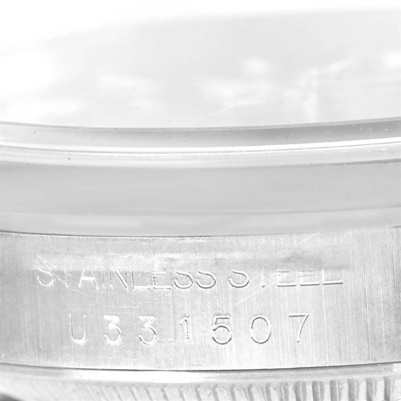 This image shows a close-up view of the serial number engraved on the case of a Rolex Explorer 14270 Men's Stainless Steel Black Dial 14270 Men's Stainless Steel Black Dial model watch.