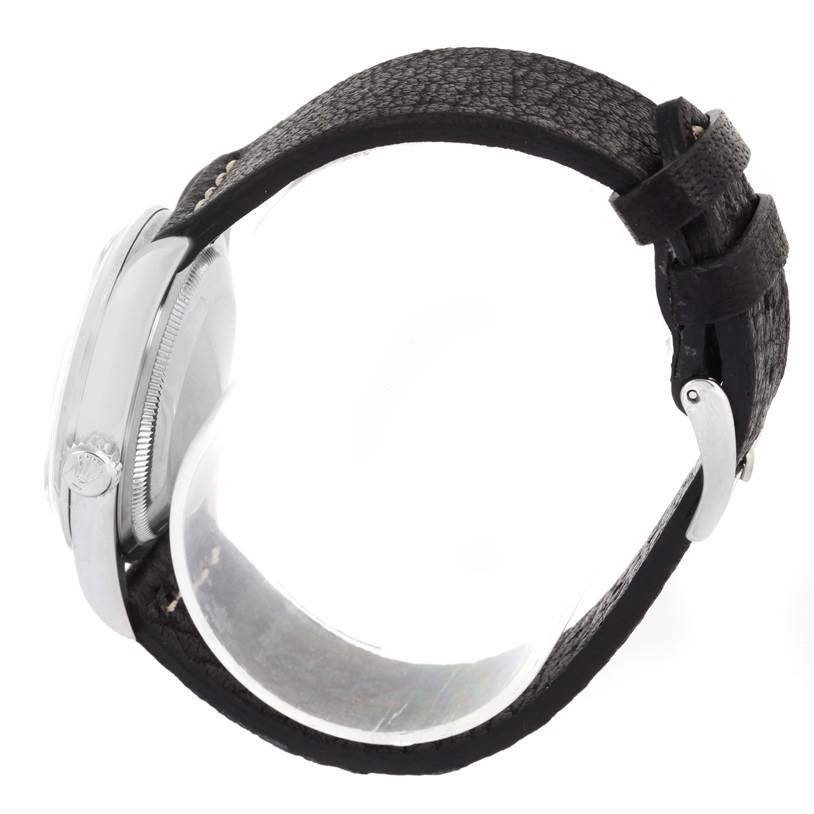 The image shows a side view of a Rolex Explorer 14270 Men's Stainless Steel Black Dial 14270 Men's Stainless Steel Black Dial watch, highlighting its case, crown, bezel, and leather strap.