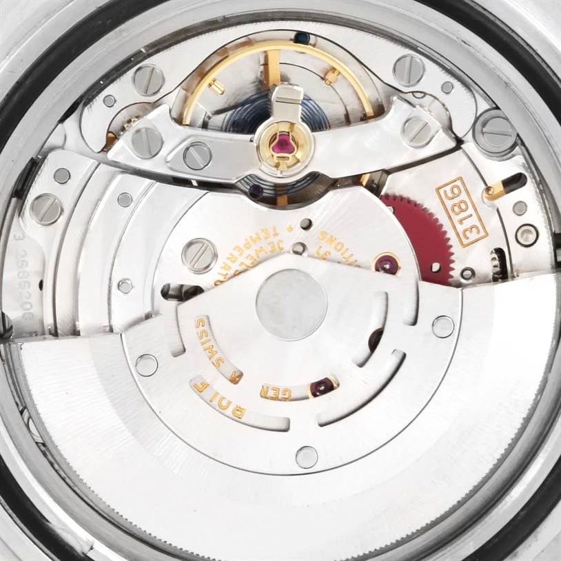 The image shows the movement mechanism of a Rolex Explorer 16570 Men's Stainless Steel White Dial 16570 Men's Stainless Steel White Dial watch, focusing on the intricate internal gears and components.