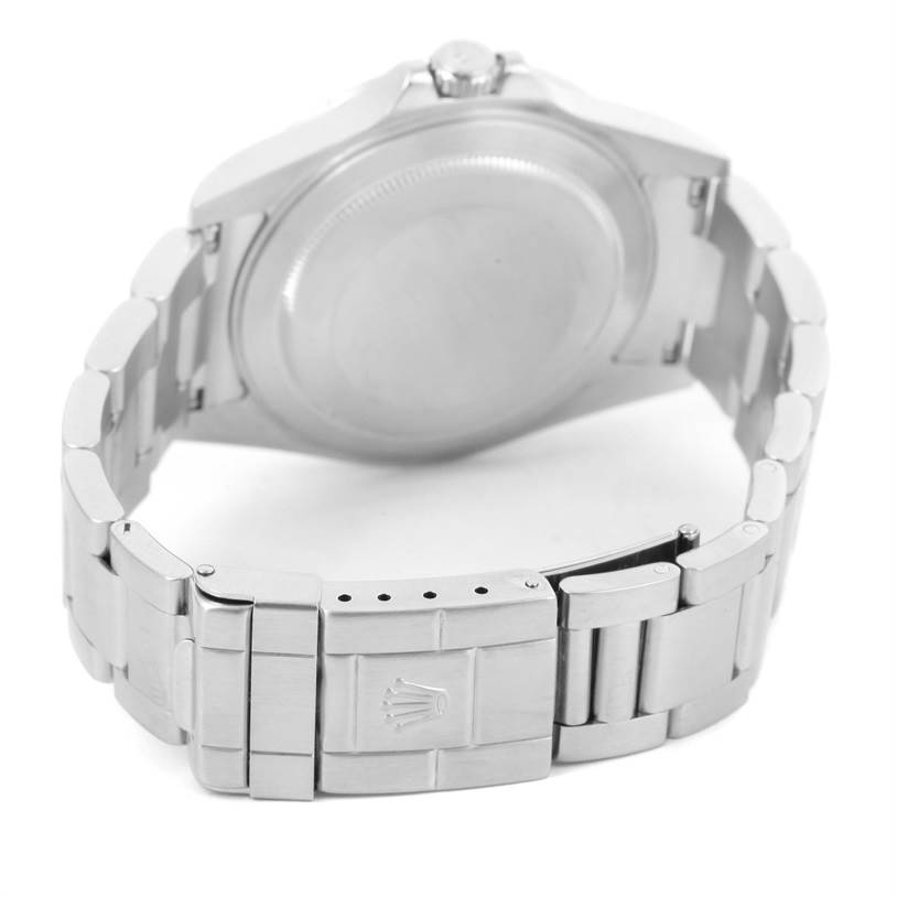 The image shows the back view of a Rolex Explorer 16570 Men's Stainless Steel White Dial 16570 Men's Stainless Steel White Dial watch, focusing on the case back and the clasp of the metal bracelet.