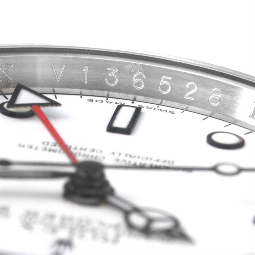 The image shows a close-up of the Rolex Explorer 16570 Men's Stainless Steel White Dial 16570 Men's Stainless Steel White Dial watch (top-angle view) focusing on the chapter ring and part of the dial and hands.