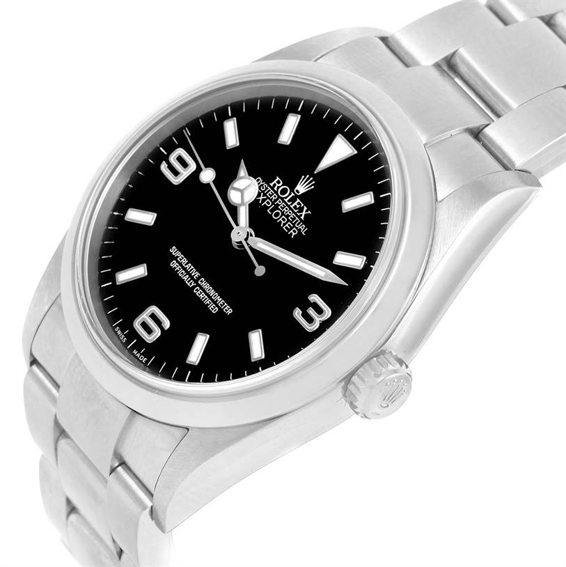 The image shows the face and bracelet of a Rolex Explorer 114270 Men
s Stainless Steel Black Dial 114270 Men
s Stainless Steel Black Dial watch at an angled view, highlighting the crown and dial.