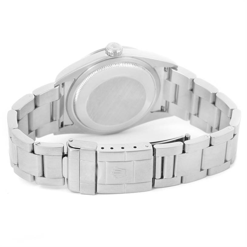 This image shows the back view of a Rolex Explorer 114270 Men
s Stainless Steel Black Dial 114270 Men
s Stainless Steel Black Dial watch, focusing on the case back and metal bracelet clasp.