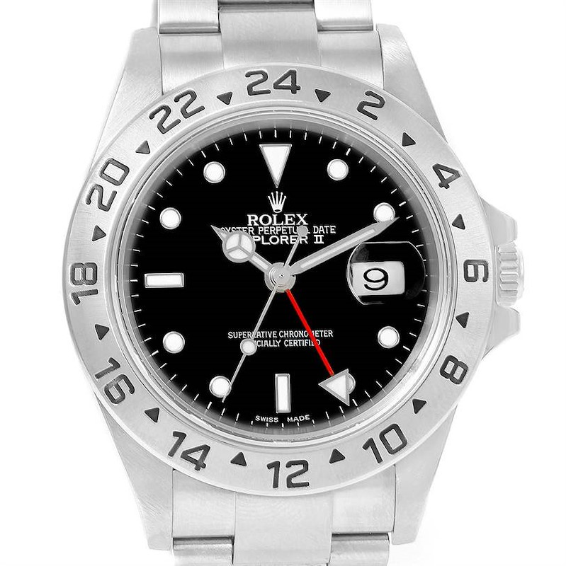 The image shows a frontal view of a Rolex Explorer II watch, highlighting the dial, bezel, and bracelet.