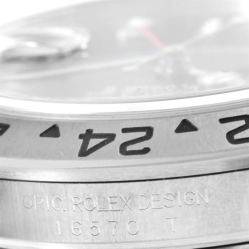 The image shows a close-up side view of the Rolex Explorer 16570 Men's Stainless Steel Black Dial 16570 Men's Stainless Steel Black Dial 16570, displaying the bezel and "ORIG. ROLEX DESIGN" engraving.