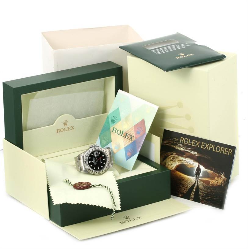 The Rolex Explorer 16570 Men's Stainless Steel Black Dial 16570 Men's Stainless Steel Black Dial watch is shown in its box along with documentation and accessories, taken from an angled perspective.