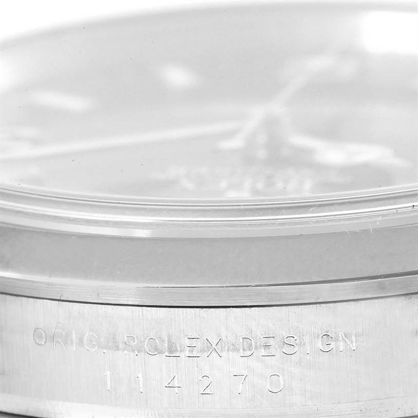 The image shows a close-up, side view of a Rolex Explorer 114270 Men's Stainless Steel Black Dial 114270 Men's Stainless Steel Black Dial watch, highlighting its etched model number "114270".